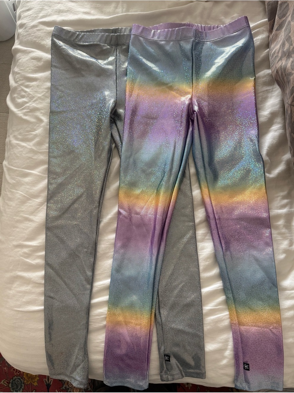 Brand new, no tags. Two size 9/10 Pixielane shimmer leggings.